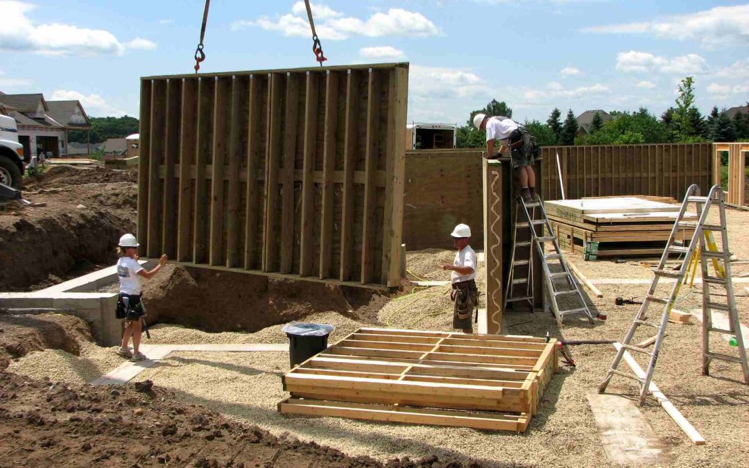 construction crew building with permanent wood foundations